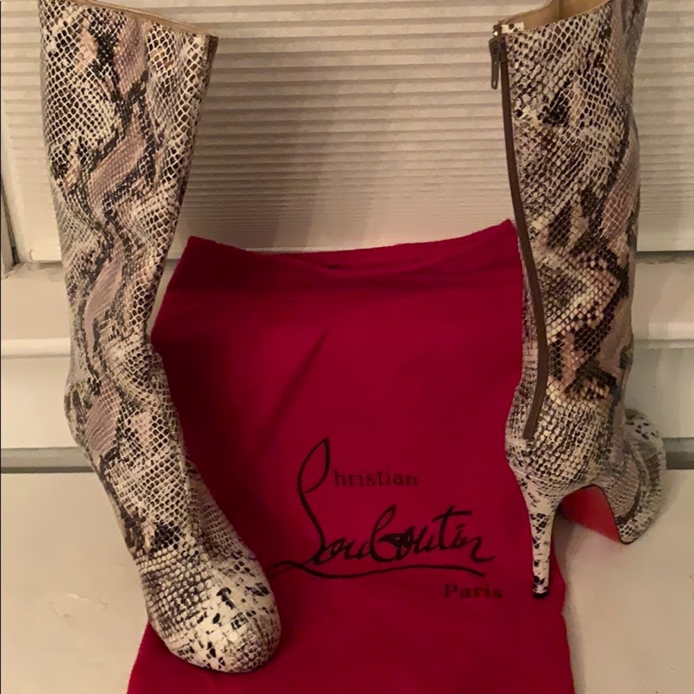 NEW CHRISTIAN LOUBOUTIN
Python Knee-High Boot